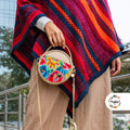 Cartera circular con bordado huanca
